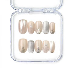 Naillover Nude Gleam handmade press on nails with champagne beige base and silver glitter accents, from Singapore press on nails collection.