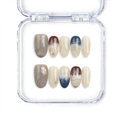 Naillover Oceanic Essence press-on nails featuring blue marbled patterns, shimmer, and gold accents, handcrafted in Singapore.