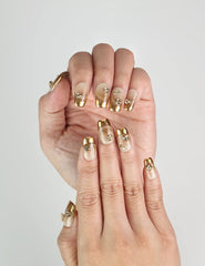 Opal Vibe handmade press on nails in beige and gold, styled for a classic and sophisticated appearance