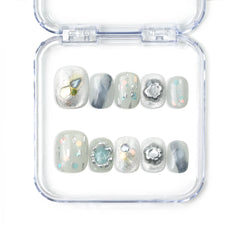 Naillover Opal Whisper handmade short press on nails in smoky grey with gold and pastel detailing from the Singapore press on nails collection.