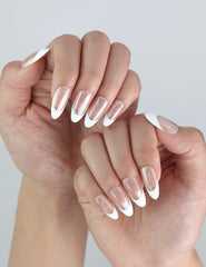 Close-up of Pearly Shine by Naillover — elegant almond press on nails with a simple yet sophisticated white shimmer.