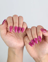 Fingers styled with Purple Pulse short purple cat eye press on nails by Naillover.