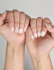 Naillover Scarlet Gleam Singapore press on nails styled with sparkling rhinestones and 3D white flowers.