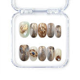 Naillover handmade press on nails in creamy white with gold leaf and pearl accents from the Singapore press on nails collection.