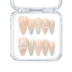 Shimmering Pearl And Floral Elegance handmade press on nails by Naillover with shell textures, floral accents, pearls, and oceanic blue tones — elegant Singapore press on nails.