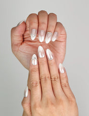 Close-up of Naillover Silver Gleam press on nails featuring sparkling rhinestones for elegant classic nail style.