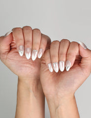 Naillover Silver Gleam Singapore press on nails styled with a chic evening outfit, highlighting rhinestone glamour.