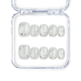 Naillover Silver Skies handmade Singapore press on nails with white base and silver star designs, perfect for trendy glamorous looks.