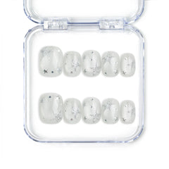 Naillover Silver Skies handmade Singapore press on nails with white base and silver star designs, perfect for trendy glamorous looks.