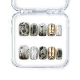 Naillover handmade press on nails in smoky gray and metallic chrome, with marble accents and sculpted textures — futuristic press on nails from Singapore.