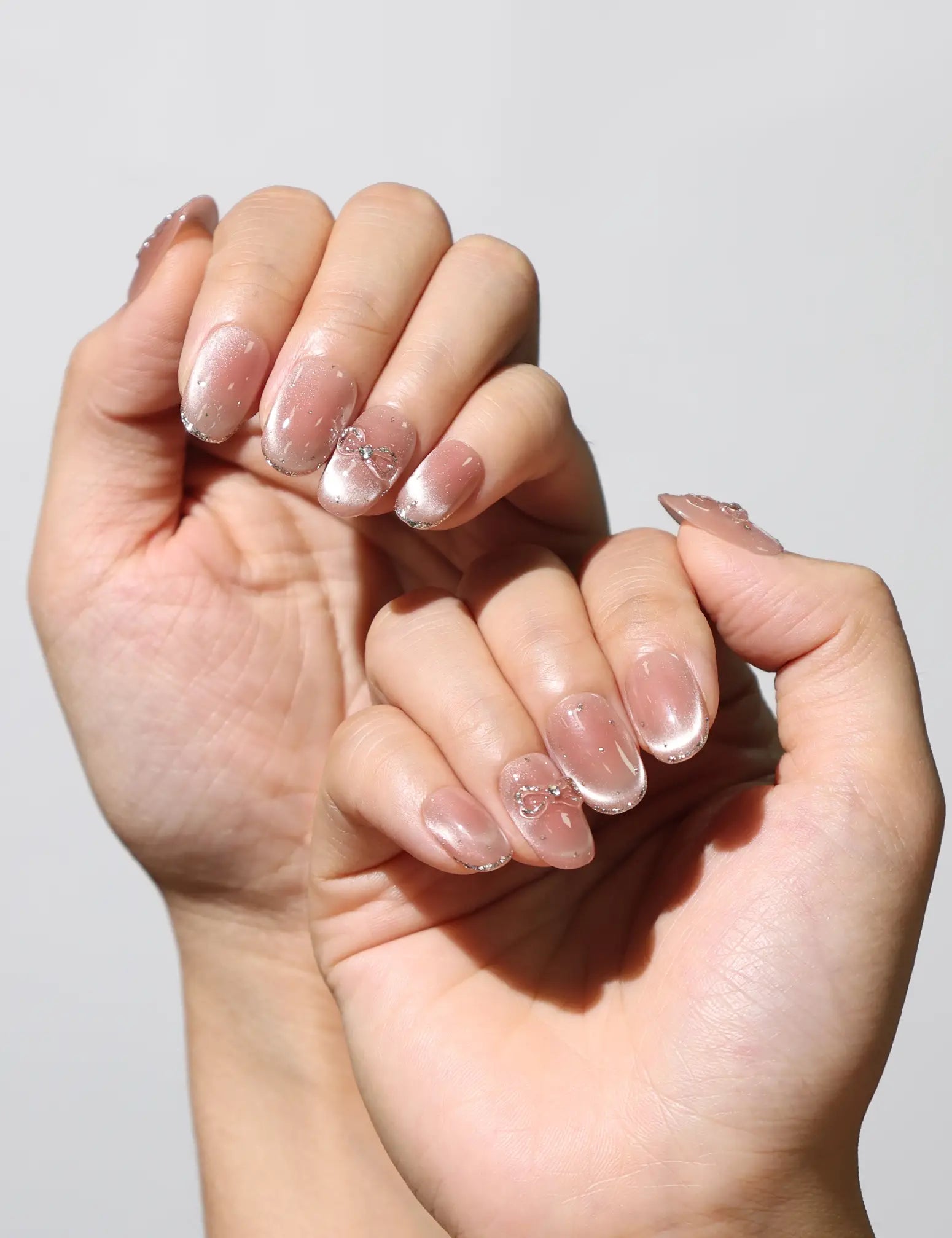 Elegant manicure featuring Sparkle Allure gradient cat eye Singapore press on nails by Naillover.