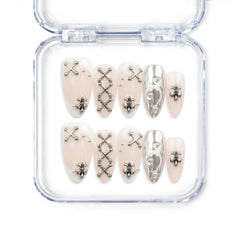 Subtle Knots handmade Singapore press on nails by naillover featuring soft beige base with delicate metallic details for a modern, classic style