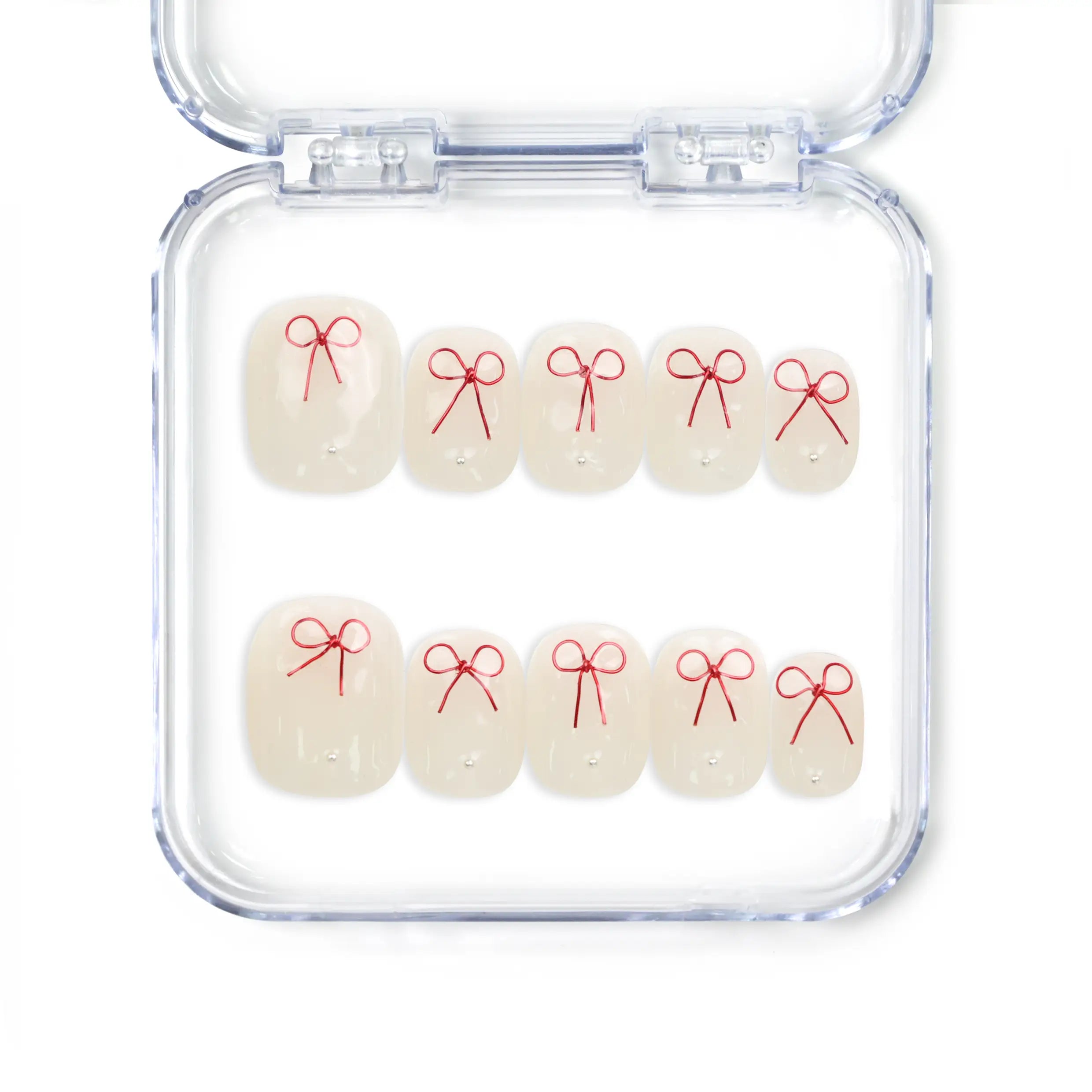 Sweet Bow handmade press on nails from Naillover, featuring white nails with red bow design, Singapore press on nails