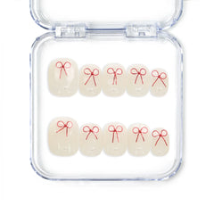 Sweet Bow handmade press on nails from Naillover, featuring white nails with red bow design, Singapore press on nails