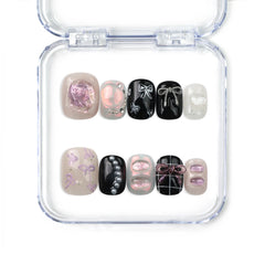 Naillover handmade press on nails in black and white with silver glitter accents, Sweet Goth style from our Singapore press on nails collection.