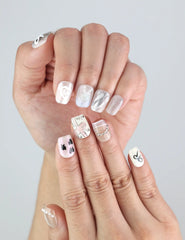 Close-up of Sweet Ribbon nails from Naillover, showing minimalist lavender tips and delicate crystal details.