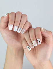 Sweet Ribbon press ons styled on petite nails—lavender French tips and cloud-white base by Naillover Singapore.