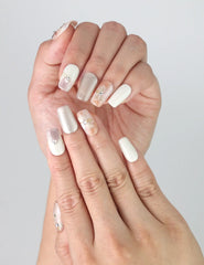 Side view of fingers styled with Twilight handmade press on nails, showing delicate petal accents and smooth pastel gradients.