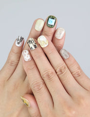 Wearing Naillover Vintage Bloom nails—3D flower press ons in soft blush tones and beige highlights.