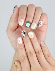 Close-up of Naillover Vintage Bloom handmade press on nails with intricate floral detailing.