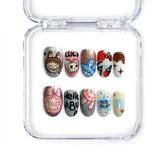Short pink handmade press-on nails with pastel cartoon art in oval shape, from Singapore brand Naillover.
