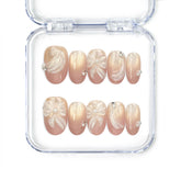 Naillover Pearl Bloom Bronze handmade press on nails with bronze floral design, shimmering accents, and delicate rhinestones from Singapore press on nails collection.