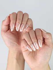 Side view of Singapore handmade almond-shaped pink nails with rose petal hue and reflective glossy surface