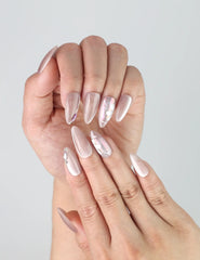 Close-up of Naillover’s handmade pastel nails featuring soft pink and lilac tones with 3D white flowers