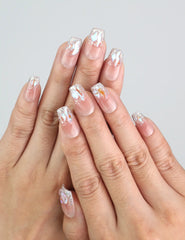 Side view of Pink Mermaid Spark coffin nails on hand, handmade press on nails with glittery flakes by naillover.