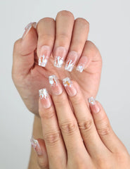 Close-up of Pink Mermaid Spark medium coffin nails worn on hand, glittery handmade press on nails from naillover’s Singapore collection.