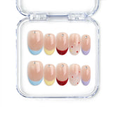 Rainbow Tips handmade press on nails by naillover, transparent base with colorful blue, yellow, and red glitter tips, Singapore press on nails for summer nails and cute looks.