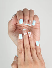 Close-up of Skyline ombre blue handmade press on nails, showing soft gradient from sheer to blue