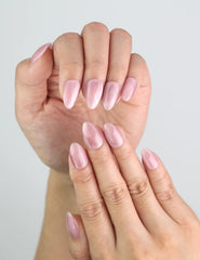 Close-up of Soft Mirage handmade press on nails by Naillover, showing soft pink shimmer.