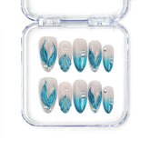 Naillover Singapore handmade blue almond nails with gradient tones, shell textures, and glitter accents inspired by mermaids