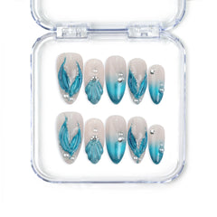 Naillover Singapore handmade blue almond nails with gradient tones, shell textures, and glitter accents inspired by mermaids