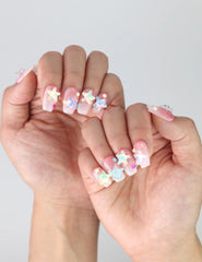 Side view of handmade short coffin pink nails with shimmer glitter and raised starfish accents from Naillover Singapore