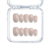 Handmade short oval press on nails in nude with crystal and glitter specks from Singapore brand Naillover