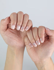 Naillover Starlit Blush handmade press on nails shown on hand in daylight, revealing soft pink tone and elegant simplicity.