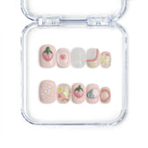 Singapore handmade short press on nails with strawberry and heart patterns on soft pink base by Naillover