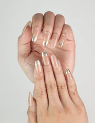 Close-up of Sunrise Hue handmade press on nails with soft peach to gold gradient – naillover