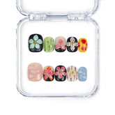 Singapore handmade pink flower nails with 3D floral art on black and nude squoval press on base by naillover