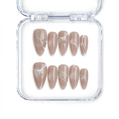 Singapore handmade press on nails in taupe with white swirl and gold accents by Naillover