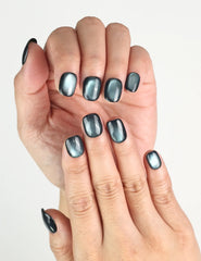 Close-up of fingers styled with Teal Gleam Singapore press on nails, handmade glossy teal iridescent finish