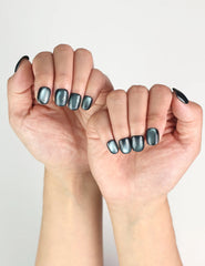 Elegant hand pose showing Teal Gleam handmade press on nails Singapore, shimmering teal finish, trendy nails style