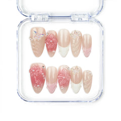 Naillover Whispering Petals in Pink Haze handmade press on nails with neutral base, 3D pink blossoms, and butterfly charms for a romantic, trendy look.