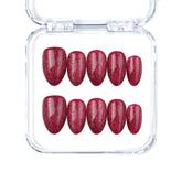 Naillover Wine Illusion handmade Singapore press on nails in wine red with almond shape and cat eye glow.