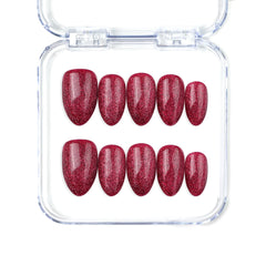 Naillover Wine Illusion handmade Singapore press on nails in wine red with almond shape and cat eye glow.