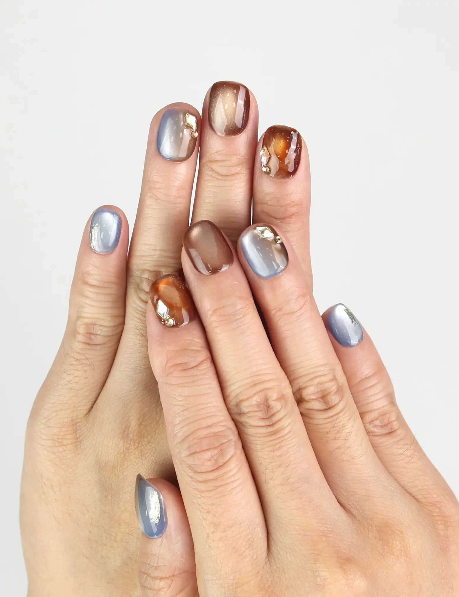 Amber Glow handmade press on nails worn on hand, showing glossy amber gradient finish by naillover