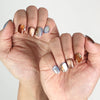 Hand model wearing Amber Glow press-on nails Singapore, classic nails with subtle shimmer finish