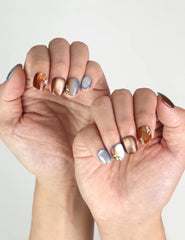 Hand model wearing Amber Glow press-on nails Singapore, classic nails with subtle shimmer finish